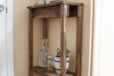 09 a rustic tall stained pallet console with an additional shelf for storage is a perfect idea for your tiny entryway
