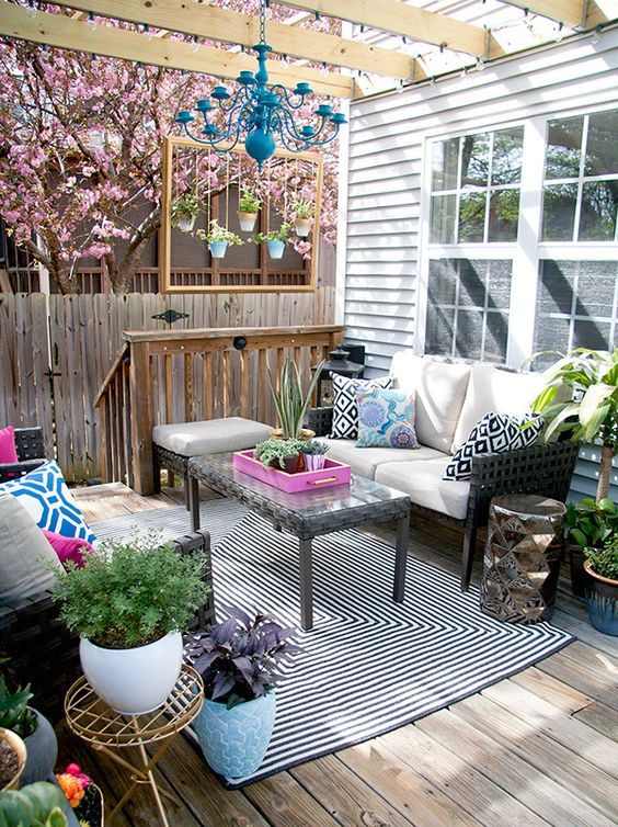 a super bright deck with touches of bold blue, hot pink and fresh greenery plus geometric prints
