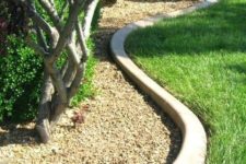 10 curved concrete garden bed edging is a chic minimalist idea that will match any plants