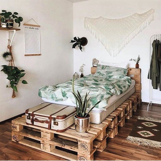 Make a pallet bed for a guest bedroom   it will give your guests much storage on top and inside