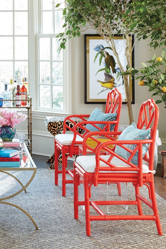 super bold red chairs with white cushions and blue pillows will immediately spruce up the space