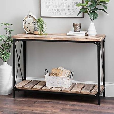 an industrial console table with metal legs and frames and pallet wood will easily fit a farmhouse entryway