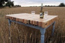 14 a gorgeous vintage-inspired dining table made of refined grey legs and a frame and a colorful stained pallet tabletop