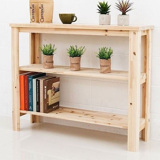 a narrow console table built of pallet wood and stained in a light shade to make it look fresher