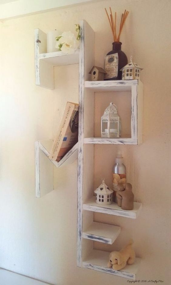 a whitewashed pallet shelving unit with many tiers is a chic idea to rock in any room