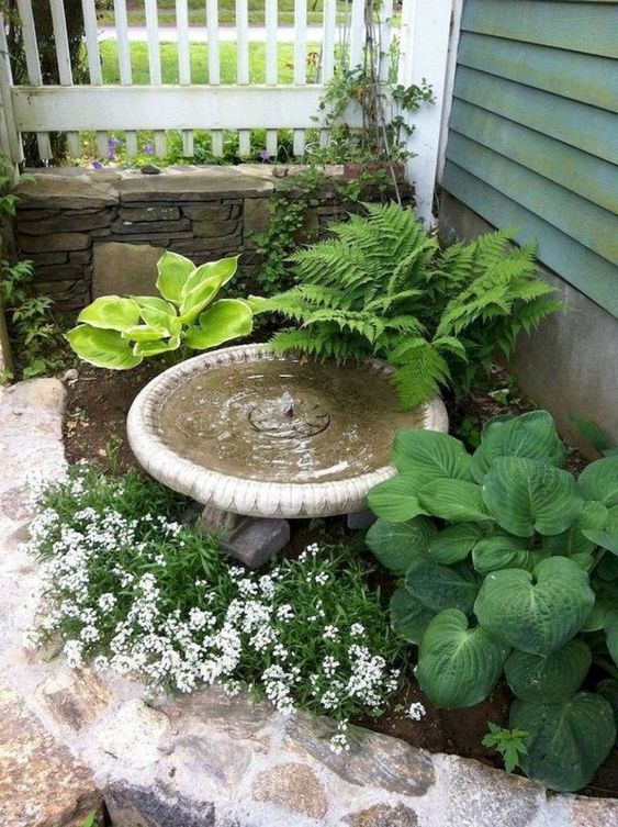 a front yard water features immediately harmonizes the space and brings a calming soung of falling water