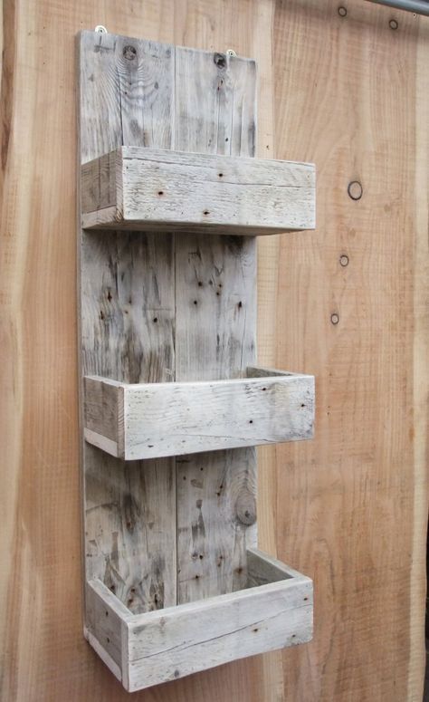 a whitewashed pallet shelf with thee layers is a great idea for an entryway, bathroom or some other small space