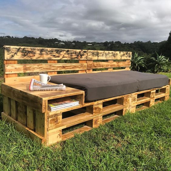 an outdoor daybed with a storage unit on one end and a back is a great idea and a simple DIY project