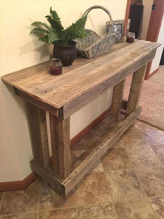 a large rustic pallet console is a cool DIY project, and you may add a shelf underneath for more storage