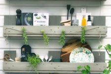 18 a trio of simple shelves in the kitchen to store eveyrthing you may need, hang stuff and even add greenery – built of pallet wood painted grey