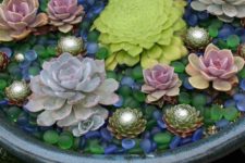 18 accent your succulents in the containers with colorful glass pebbles like these ones