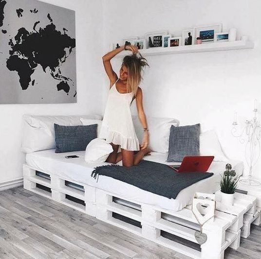 finish off your cozy nook for reading and chilling with a whitewashed pallet bed and soem storage space