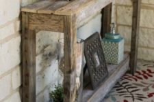 19 a large rustic pallet console table with a shelf underneath can be built by you yourself