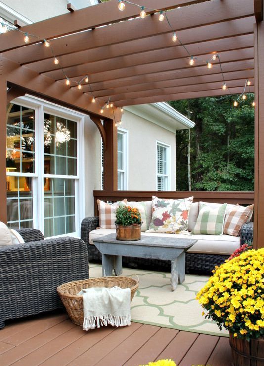 potted blooms and greenery and a nasket for storage are ideal to accessorize a rustic deck