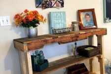 21 a rustic stained pallet console table with several shelves brigns enough storage space to the entryway