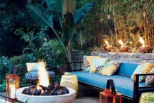 21 colorful pillows, red lanterns with candles, perforated tables and a large fire bowl to create an ambience
