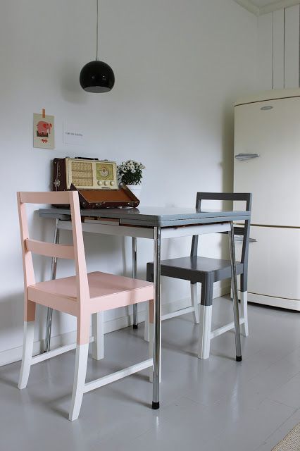 painted color block chairs in graphite grey, pink and dove grey for a retro dining space