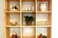 22 a mobile storage unit build of pallet wood stained light is a cool unit for a kitchen or a dining space – here you’ll see glasses and pots stored