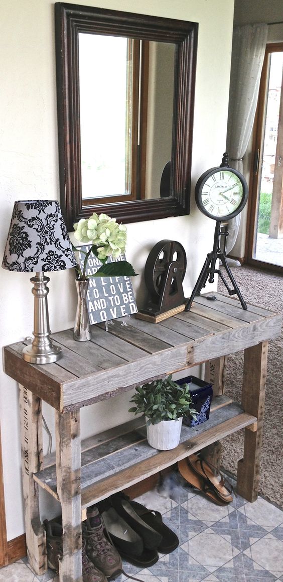 a rustic vintage pallet console table left unstained features a raised shelf, so you may place your shoes under it