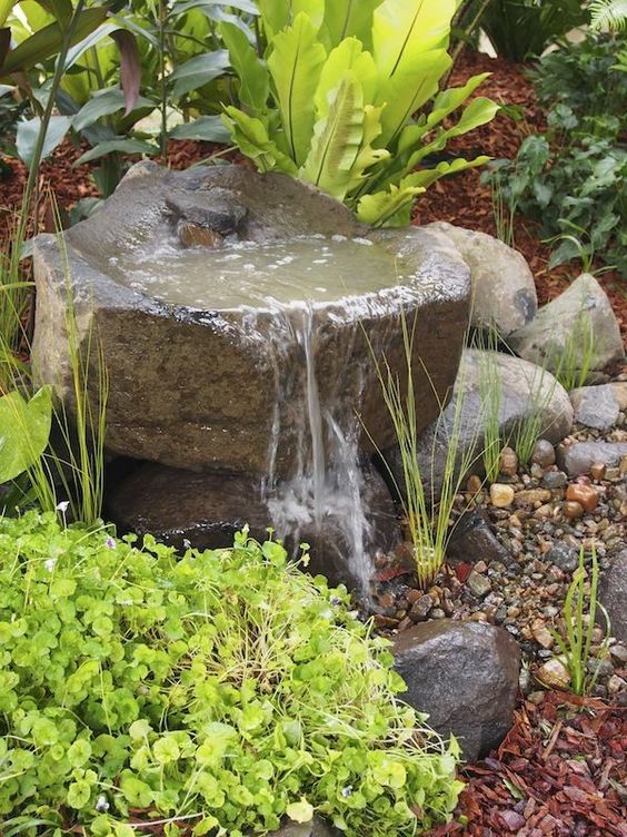 rock gardens are ideal for any garden, they are very natural and that water sound is relaxing