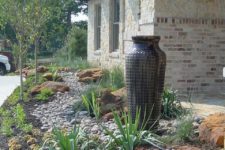 22 such a no flower front yard with a large vase fountain, rocks, agaves and grasses is a bold modern idea