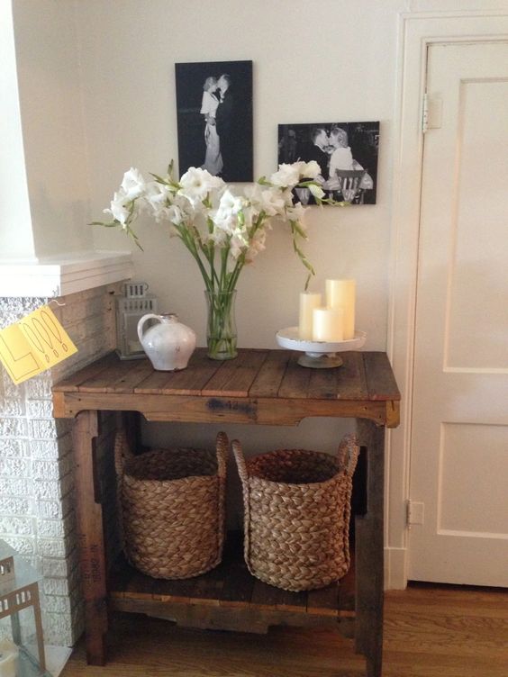 a simple rustic pallet console stained in a rich color perfectly fits a small awkward nook