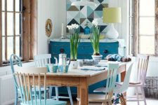 a dining area with mismatching chairs