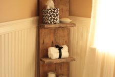 25 a sleek bathroom shelf with several tiers for bathroom stuff and towels is a stylish idea for a rustic bathroom