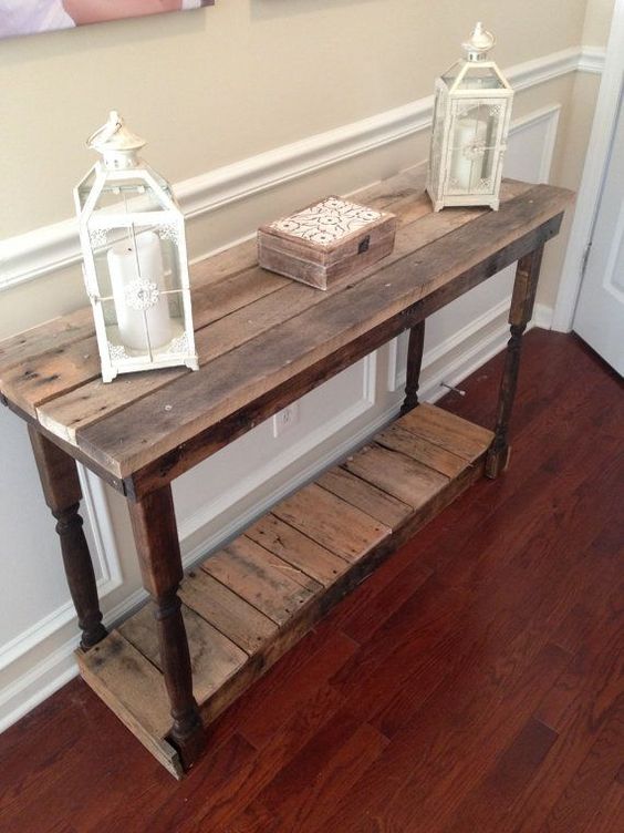 a vintage farmhouse console built of pallet wood and exquisite legs taken from another furniture piece