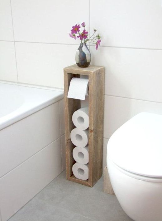 a sleek toilet paper roll holder with some storage space on top is a great for a bathroom with lack of space