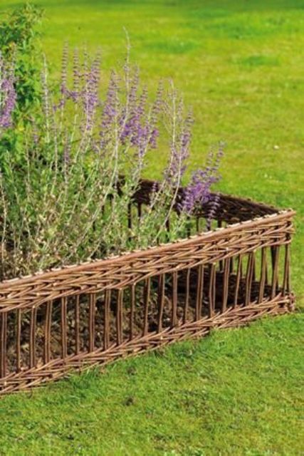 chic and delicate woven basket garden bed edging for a subtle rustic look