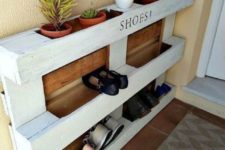 27 an easy pallet shoe rack in white and with stained parts features shoe storage and storage for pots with succulents