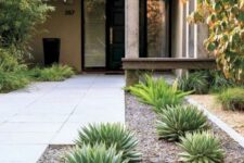 a laconic modern front yard with a stone path and succulents, some tall shrubs and trees around is a paceful space