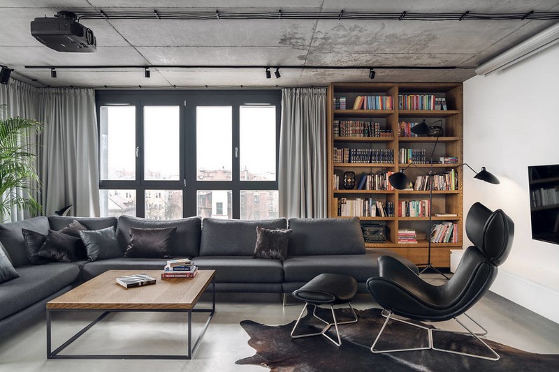 This contemporary penthouse is done with some industrial touches that are softened with some materials and items