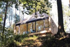 01 This off-grid cabin is located in the forest and reminds of a treehouse allowing you to enjoy the views and nature that seems to be indoors, too
