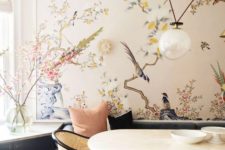 02 a refined dining space with a beautiful statement wall with flora and fauna that cozies up the space