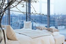 a bedroom with a great city view