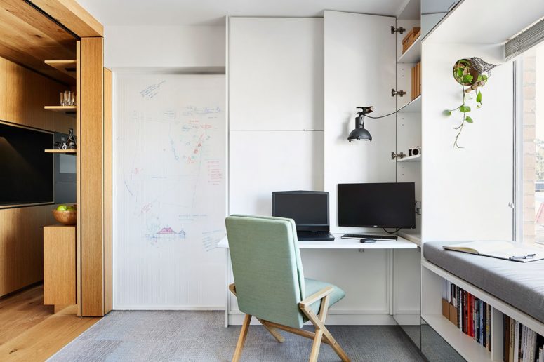 The work station in the living room can be hidden anytime for more functionality of the space