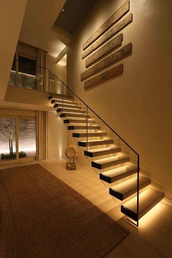 highlight your gorgeous floating staircase with strip lighting lining up each step