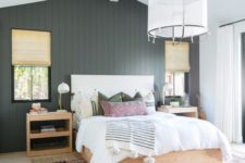 04 a chic farmhouse bedroom done with a black shiplap statement wall that adds drama and elegance to the space