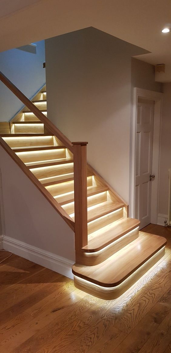  each step highlighted with strip lighting makes the staircase look more modern and edgy