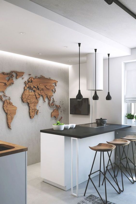 a wooden world map on the wall with pins is a cool idea to look at it while eating at the counter