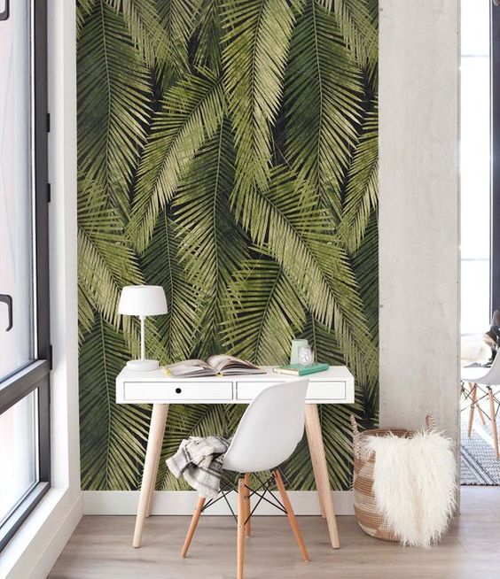 a tiny home workspace accented with removable banana leaf wallpaper for a blam and fun touch