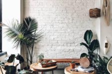 07 a white brick wall adds texture to this cozy boho chic nook and makes a nce backdrop for greenery and stained furniture