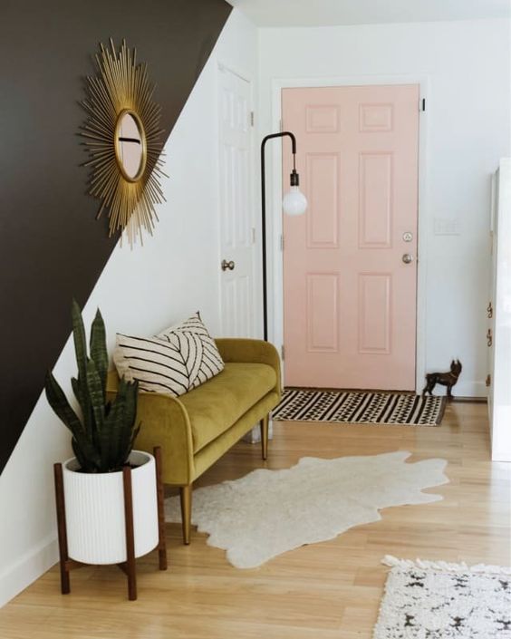 make a mid-century modern statement with a mustard-colored upholstered mini sofa in your entryway