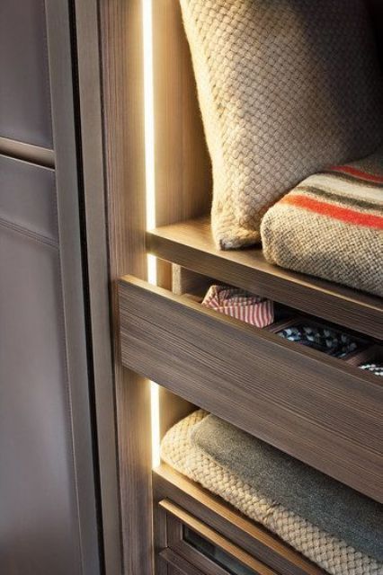 strip lights accenting each shelf and drawer will let you easily find each piece even if the other lights are off