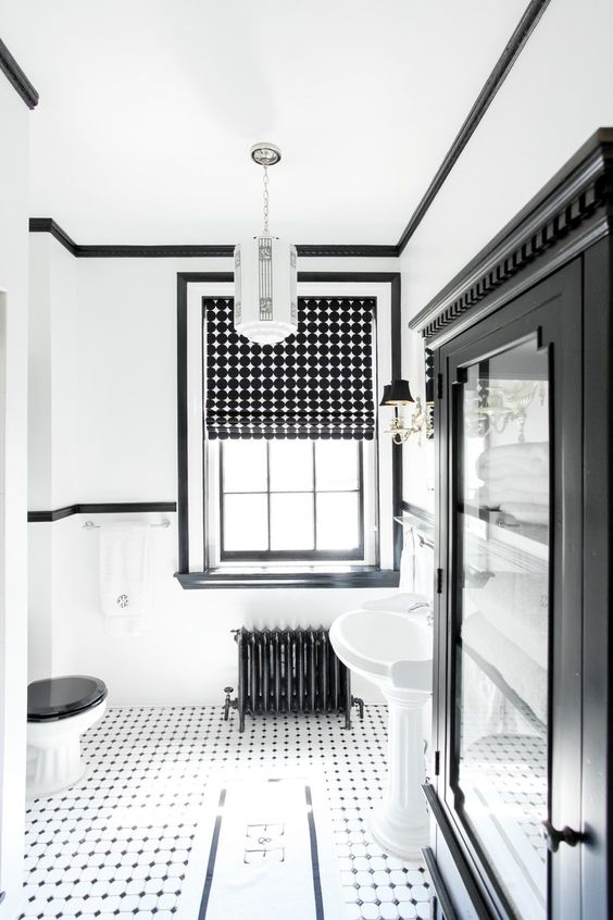 a bold monochromatic bathroom with printed Roman shades that add interest to the space