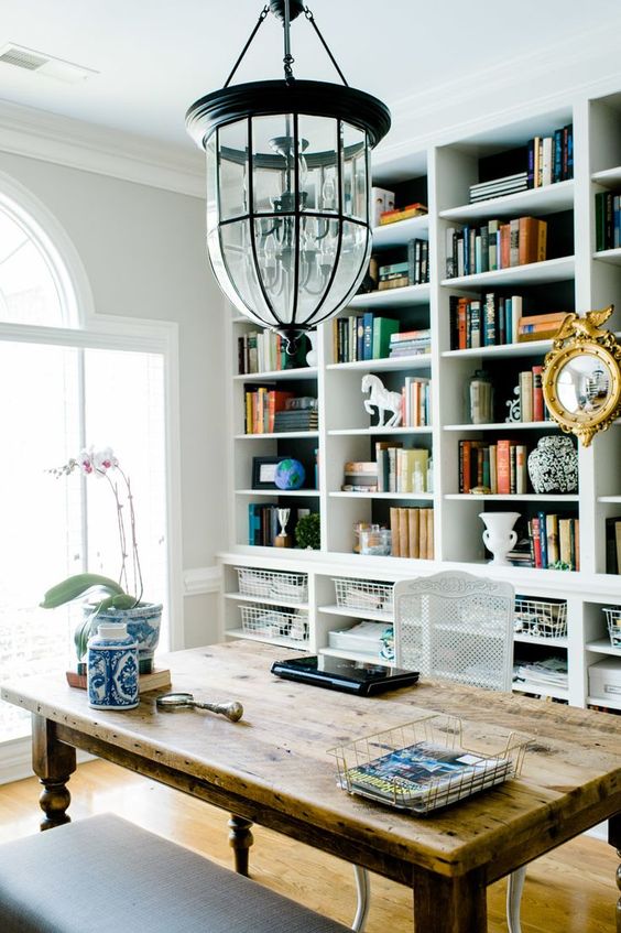 a whole wall taken by shelves and wire baskets below for smaller stuff is a cool and contemporary idea