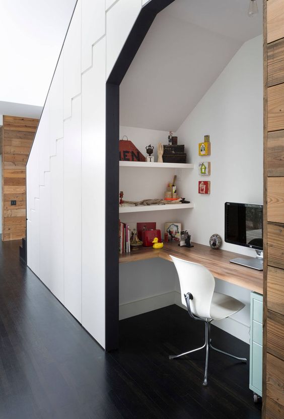 an under the stairs space can also become a nice space for storage or a real home office