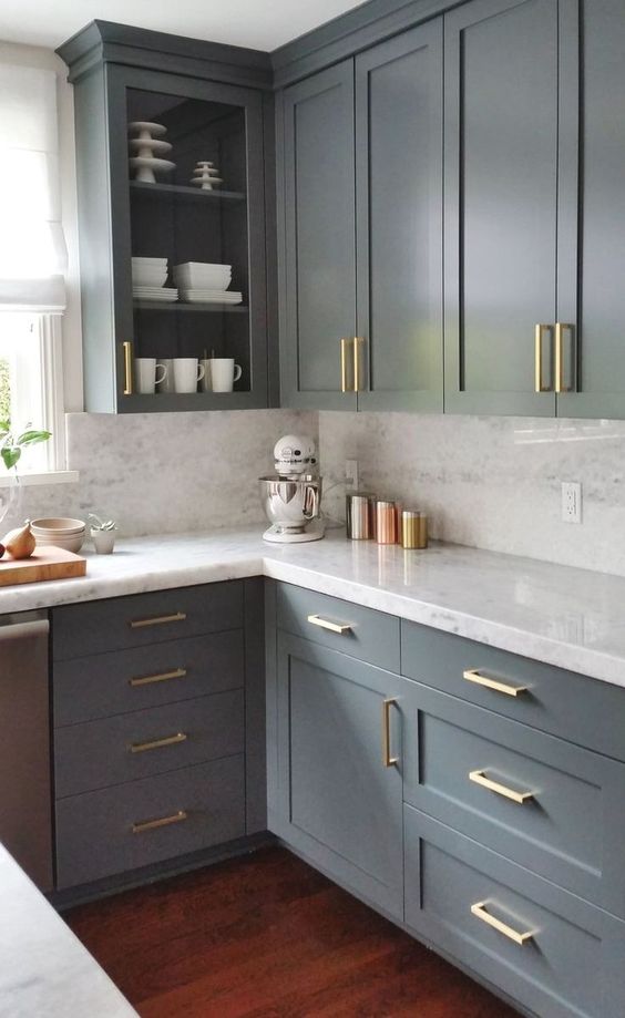 spruce up with neutral grey kitchen with gold handles to make it bolder and more chic
